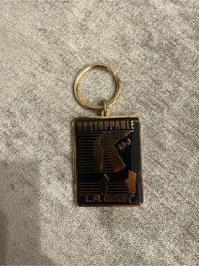 L.A. Gear Black and Gold 'Unstoppable' Rectangular Keychain